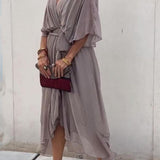 Robe Femme Cristi – Élégante Robe Portefeuille avec Manches Chauve-Souris & Ourlet Asymétrique