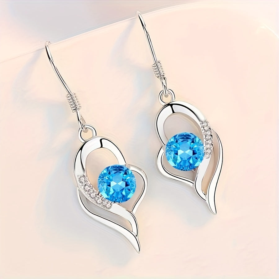 Eterna, boucles d'oreilles pendantes en forme de cœur - détail du bijou