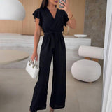 Rochelle Combinaison Femme – Élégante Combinaison Unie avec Décolleté en V, Ceinture & Jambes Amples à Volants