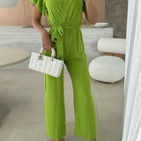 Rochelle Combinaison Femme – Élégante Combinaison Unie avec Décolleté en V, Ceinture & Jambes Amples à Volants