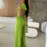 Rochelle Combinaison Femme – Élégante Combinaison Unie avec Décolleté en V, Ceinture & Jambes Amples à Volants