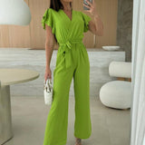 Rochelle Combinaison Femme – Élégante Combinaison Unie avec Décolleté en V, Ceinture & Jambes Amples à Volants