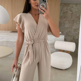 Rochelle Combinaison Femme – Élégante Combinaison Unie avec Décolleté en V, Ceinture & Jambes Amples à Volants