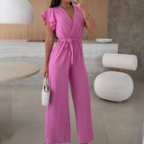 Rochelle Combinaison Femme – Élégante Combinaison Unie avec Décolleté en V, Ceinture & Jambes Amples à Volants