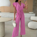 Rochelle Combinaison Femme – Élégante Combinaison Unie avec Décolleté en V, Ceinture & Jambes Amples à Volants