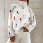 Caroline - Pull à col roulé blanc à motif de skieurs