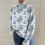 Sarah - Pull à col roulé blanc et bleu à motif floral